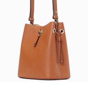 Kate Spade genuine leather bucket style with locket on front